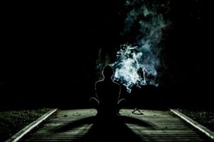 Person smoking in the dark